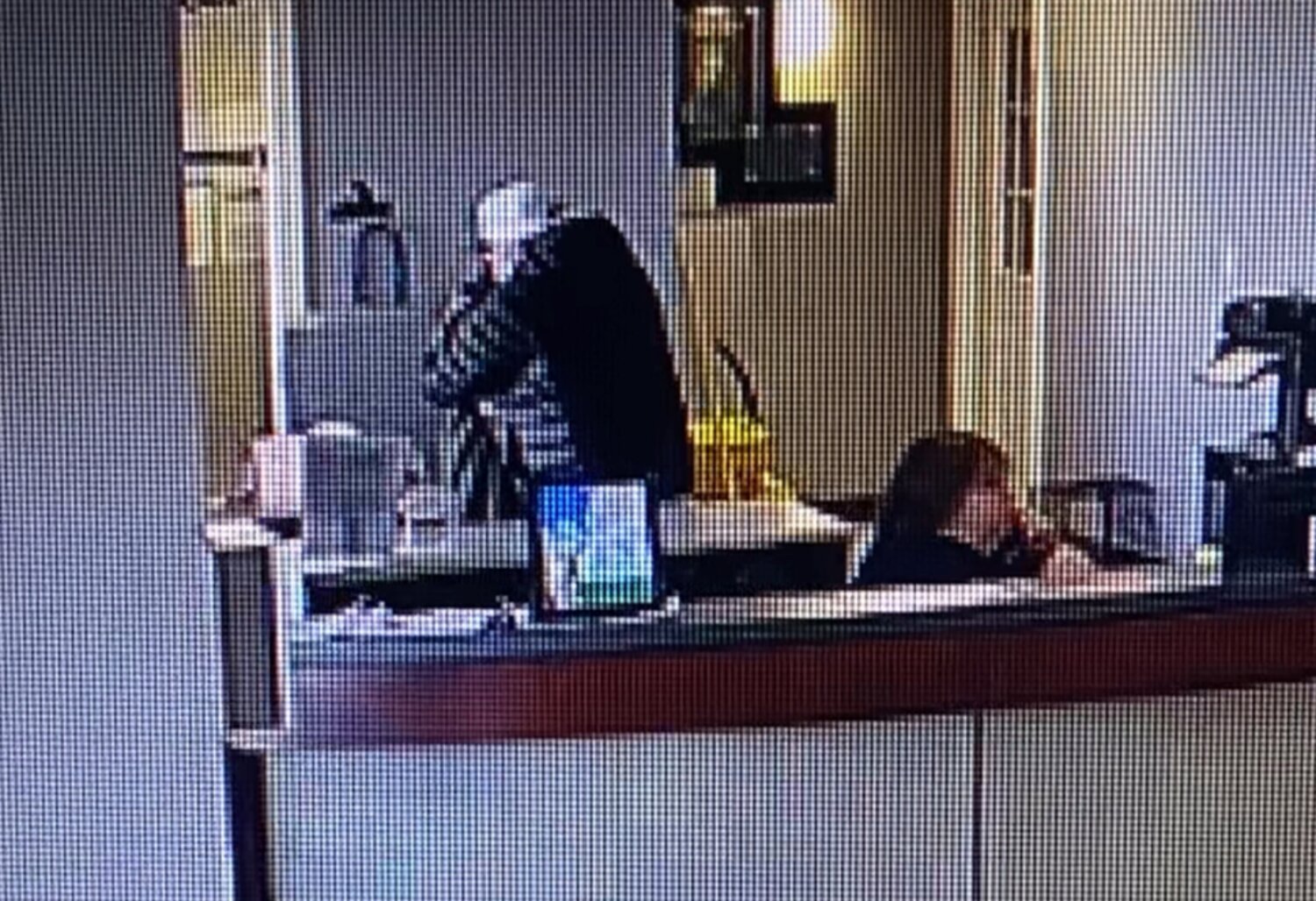 Surveillance footage captures Executive Director Darren Ullmann embracing the suicidal dog owner, Tuesday, Nov. 28 at the Humane Society of Cowlitz County in Longview.